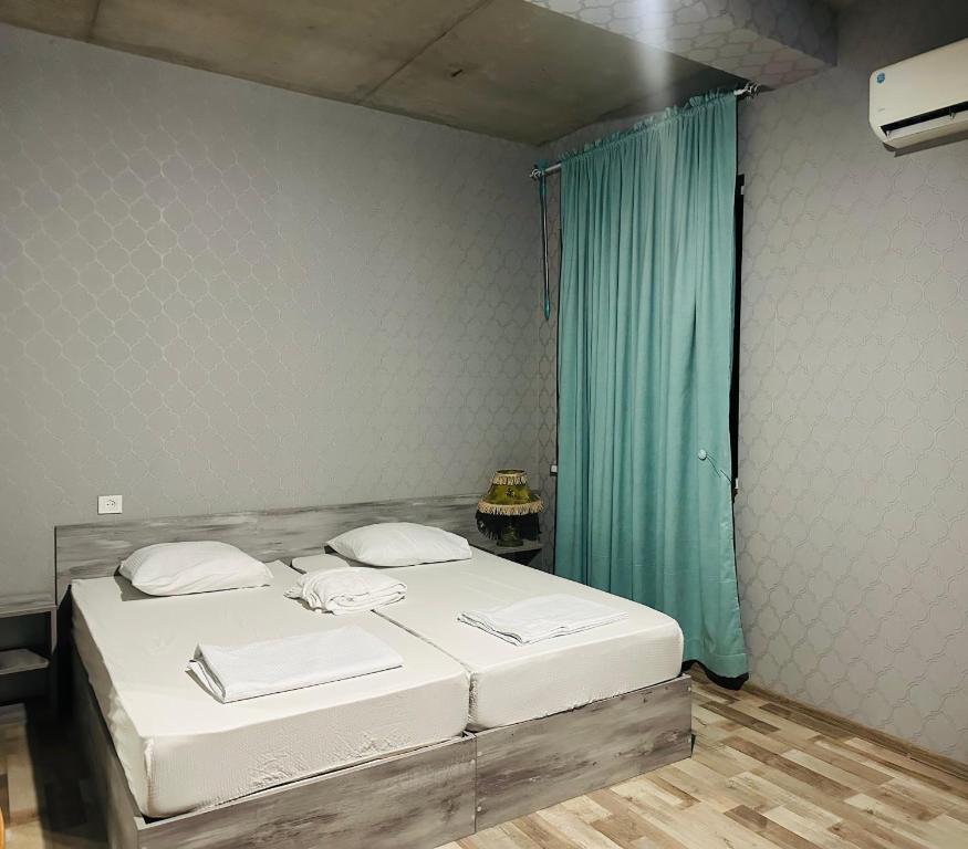 Postel nebo postele na pokoji v ubytování Nid Hotel