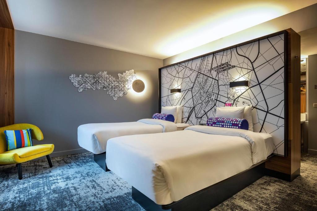 Tempat tidur dalam kamar di Aloft Brussels Schuman