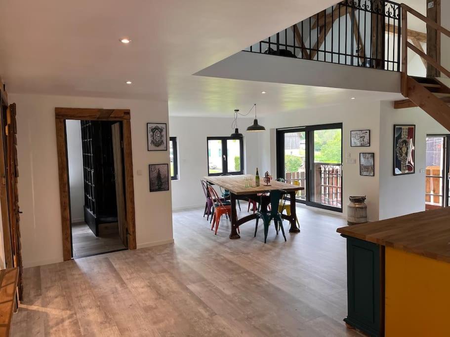 a kitchen and dining room with a table and chairs at Le grenier a foin in Breitenbach-Haut-Rhin