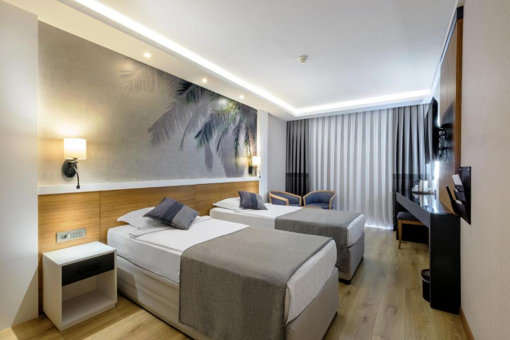Postel nebo postele na pokoji v ubytování Alba Resort Hotel - Ultra All Inclusive