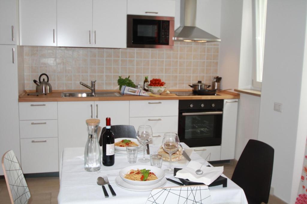 a kitchen with a table with a plate of food on it at Appartamenti Giusy e Giusy 2 in Sorrento