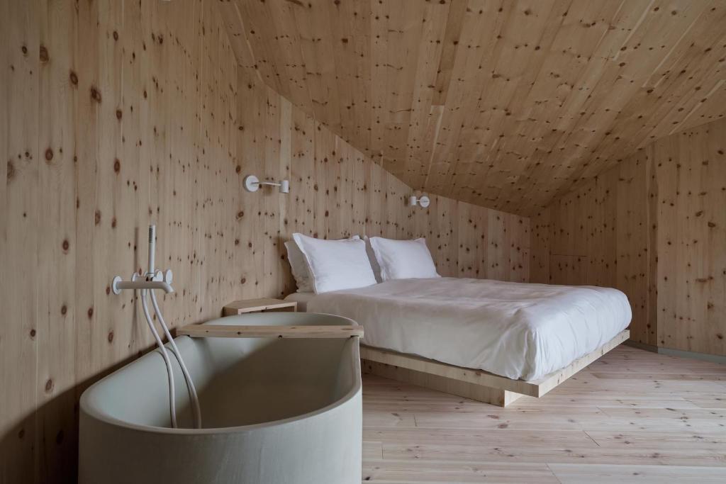 A bed or beds in a room at Odles Lodge