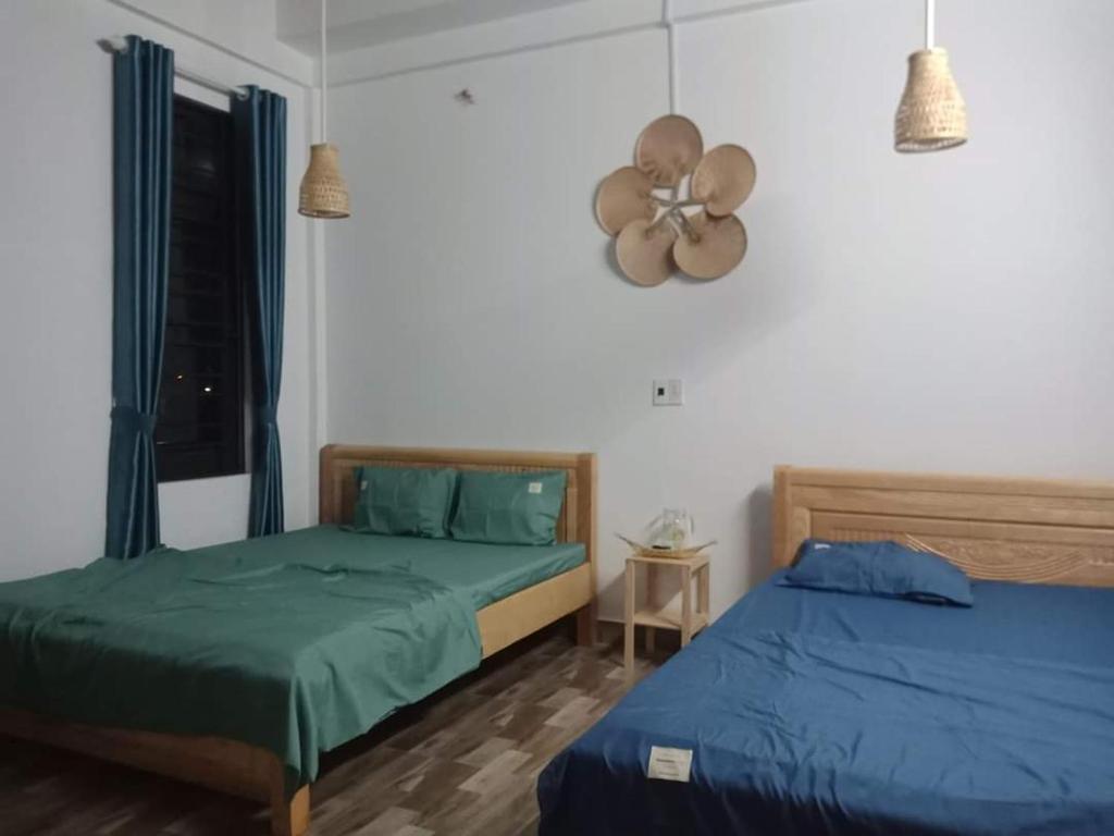 Postel nebo postele na pokoji v ubytování Xuka Homestay