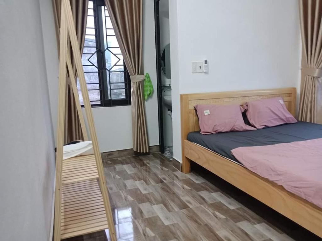 Postel nebo postele na pokoji v ubytování Xuka Homestay