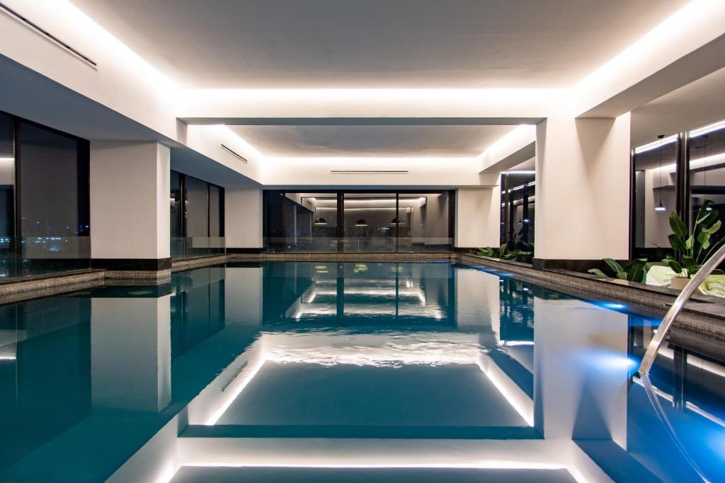 a swimming pool in the middle of a building at Mexication Penthouse: Urban Retreat Col. American in Guadalajara