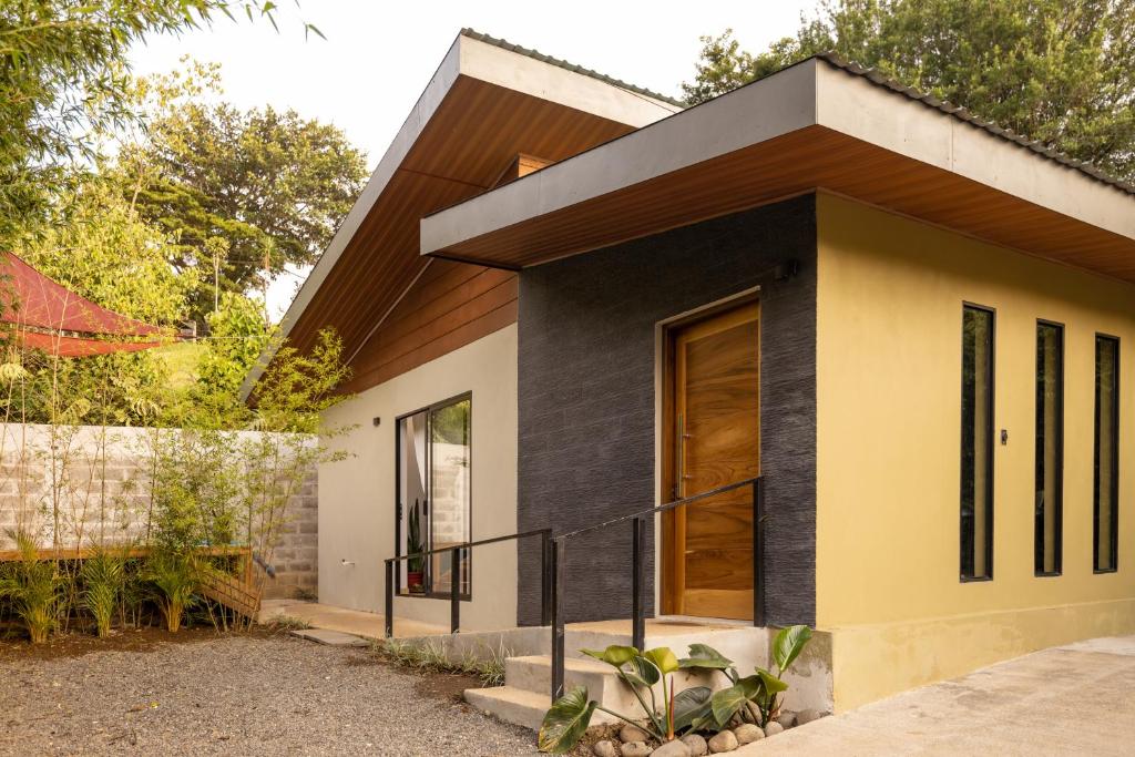a house with a black and white facade at Gamai Full House Monteverde in Monteverde Costa Rica