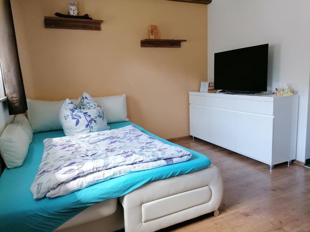 Postel nebo postele na pokoji v ubytování Ferienwohnung Max
