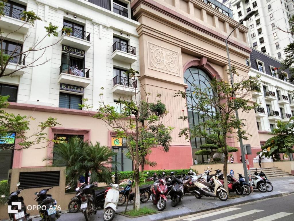 a group of motorcycles parked in front of a building at Happiest Homestay 2 - Manor Crown Hue in Thôn Trường Giang