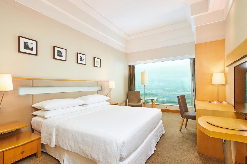 Postel nebo postele na pokoji v ubytování Four Points by Sheraton Shenzhen