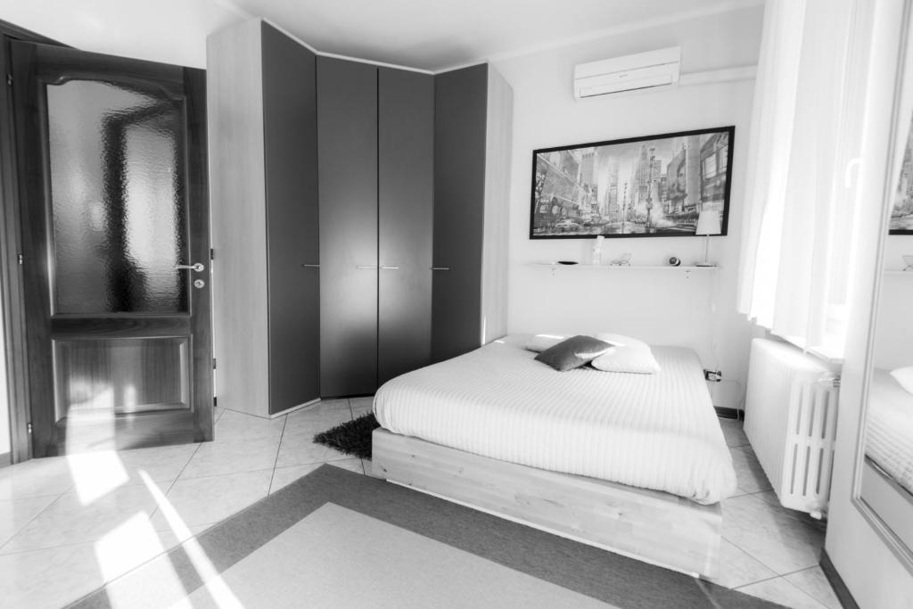 A bed or beds in a room at B&B - Il Portichetto