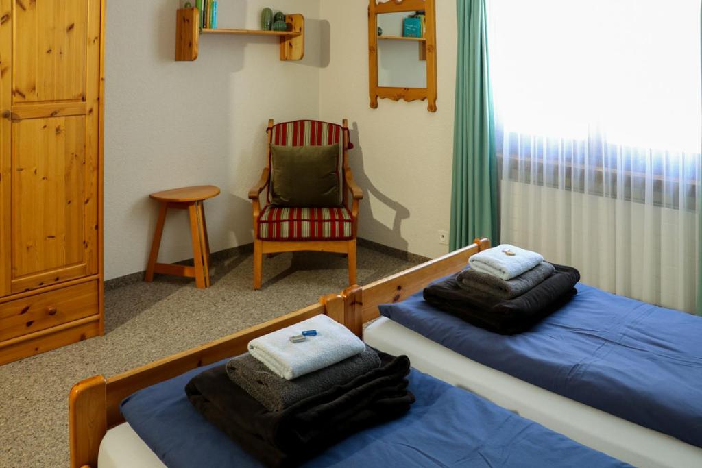Postel nebo postele na pokoji v ubytování Chesa Dominium