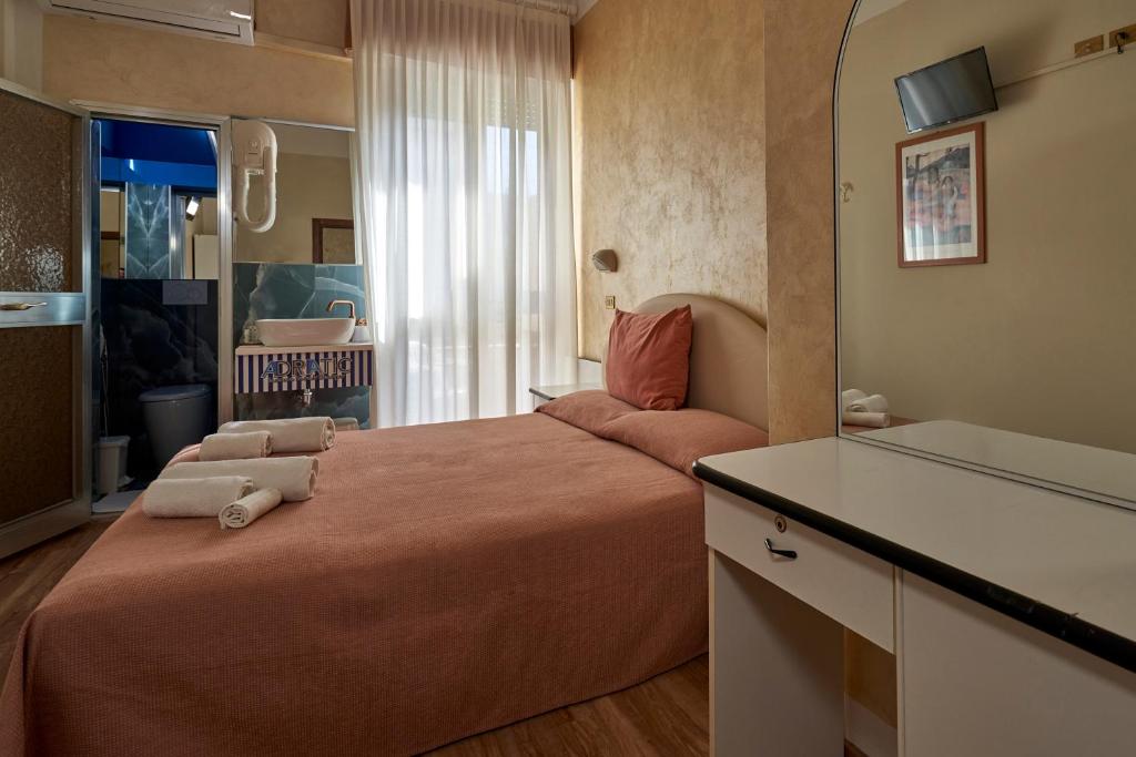 Posteľ alebo postele v izbe v ubytovaní Hotel Adriatica sul Mare
