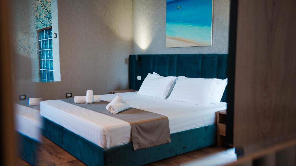 Postel nebo postele na pokoji v ubytování Hotel Majestic