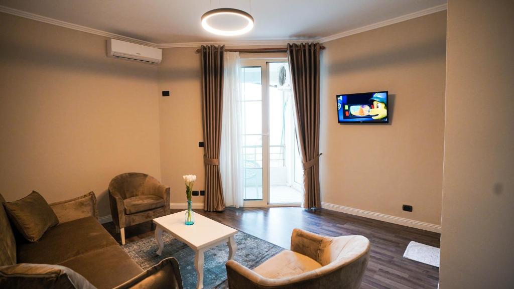 TV a/nebo společenská místnost v ubytování Hotel Majestic