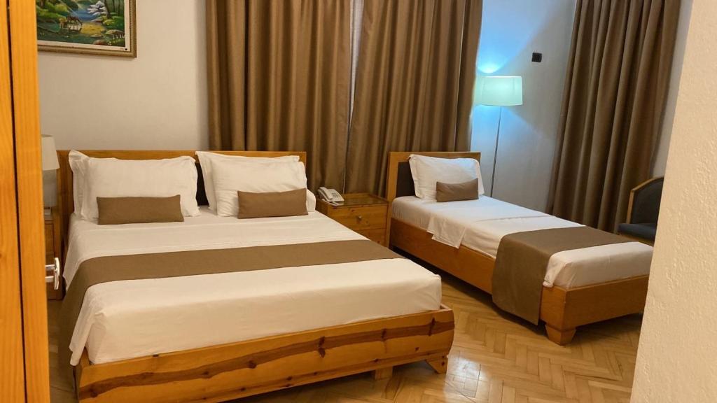 Postel nebo postele na pokoji v ubytování Rambuje Resort