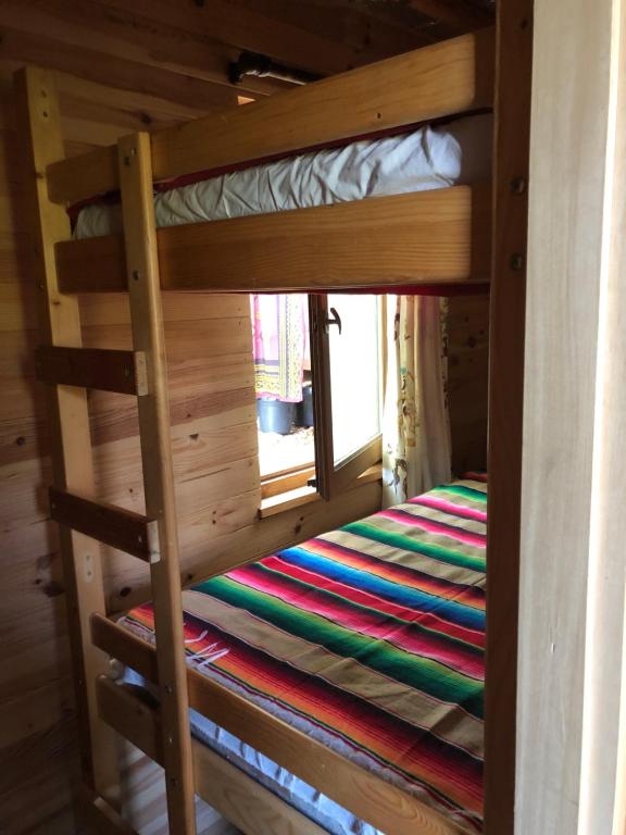 Postel nebo postele na pokoji v ubytování Fenêtre sur les Pyrénées