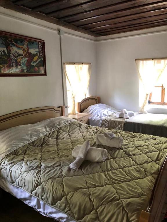 Posteľ alebo postele v izbe v ubytovaní Guesthouse Kujtimi