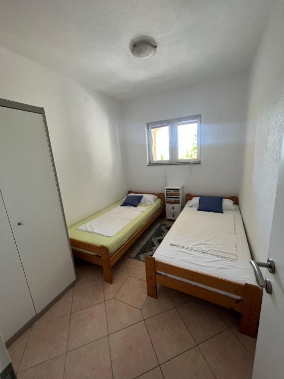 Postel nebo postele na pokoji v ubytování Casa Mare Rtina Garten Zwei Baeder EG