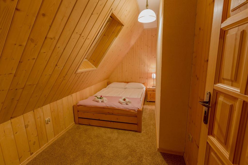 Posteľ alebo postele v izbe v ubytovaní Apartament Kościeliska 10A