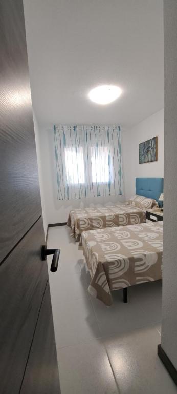 Posteľ alebo postele v izbe v ubytovaní APARTAMENTO HECO