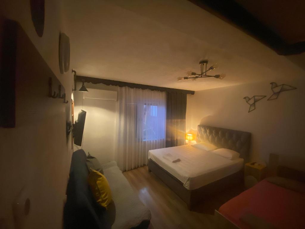 Postel nebo postele na pokoji v ubytování ZANI Hostel