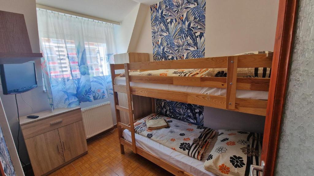 Postel nebo postele na pokoji v ubytování Napsugár Apartmanház
