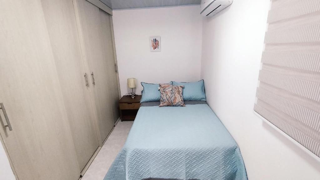 Postel nebo postele na pokoji v ubytování Edificio GrandSky