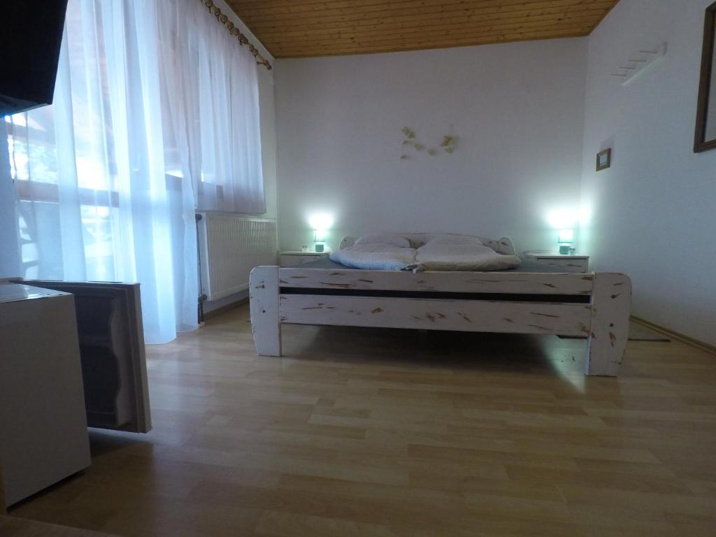 Posteľ alebo postele v izbe v ubytovaní Napsütötte Kehida