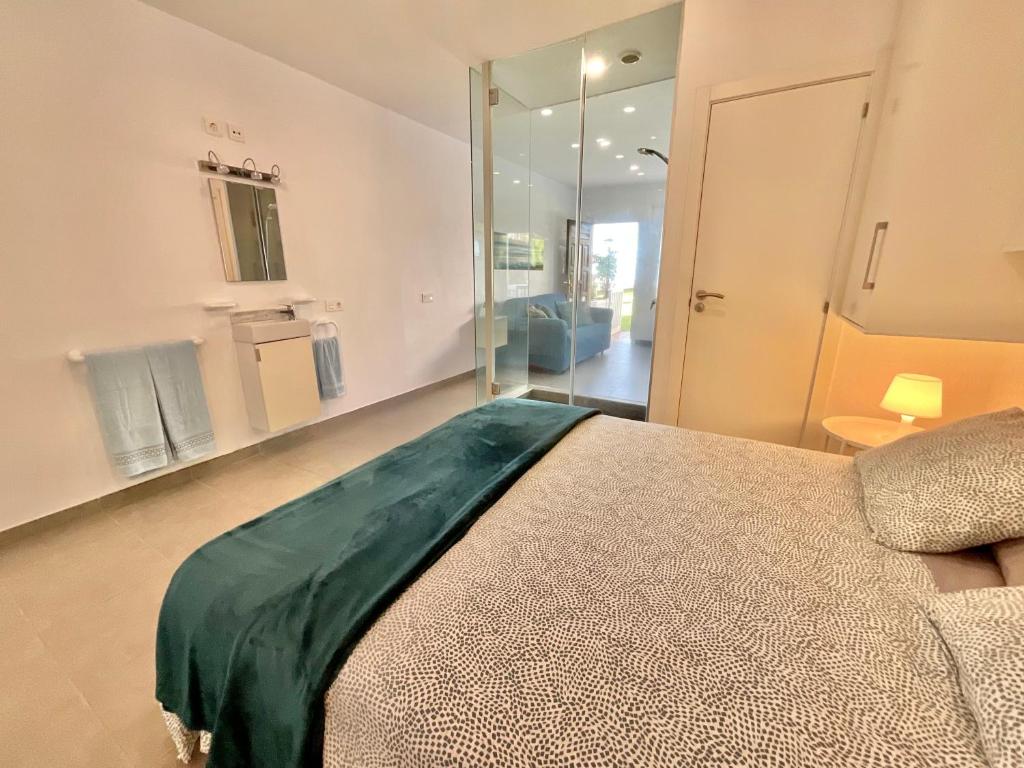 Postel nebo postele na pokoji v ubytování Blue Oasis
