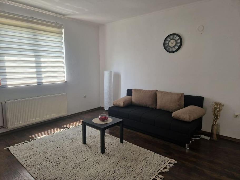 a living room with a couch and a table at Apartman Sofija in Banja Luka