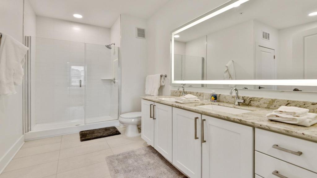 a bathroom with a shower and a sink and a toilet at Beltline 1 bdrm Apt in Atlanta