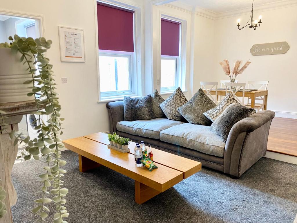 a living room with a couch and a coffee table at 3 Queen Alexandra Road in North Shields