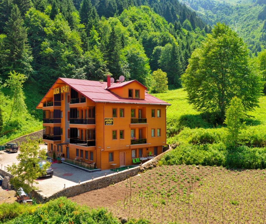 a large building in the middle of a field at Auga Apart in Uzungol