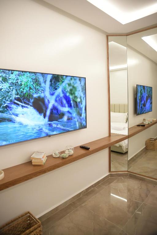 TV a/nebo společenská místnost v ubytování AKS Home appart 2 - CABONEGRO