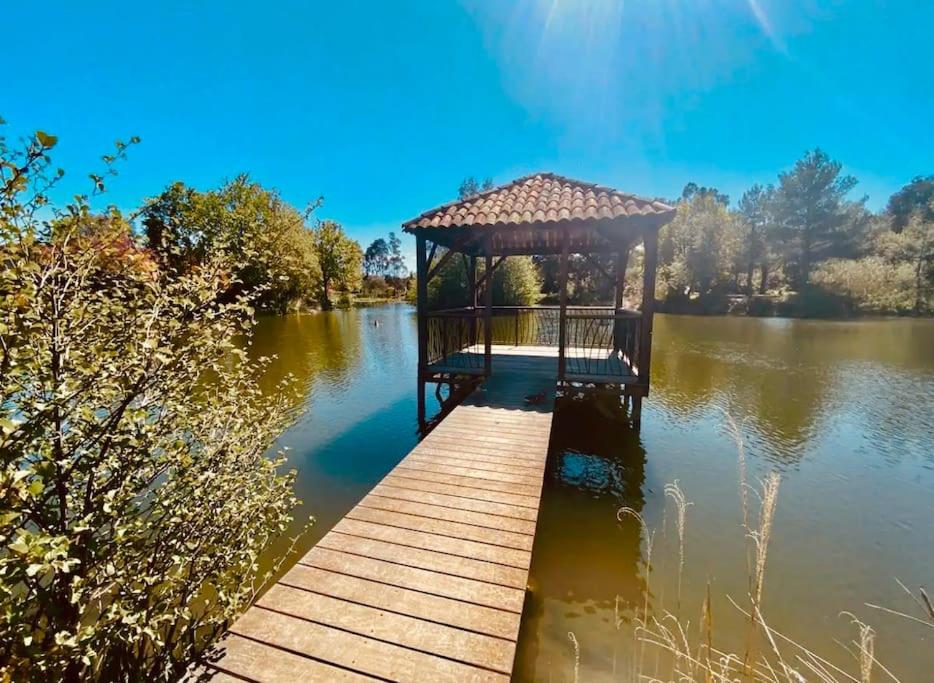 a gazebo in the middle of a lake at Vue panoramique mer et collines in Grimaud