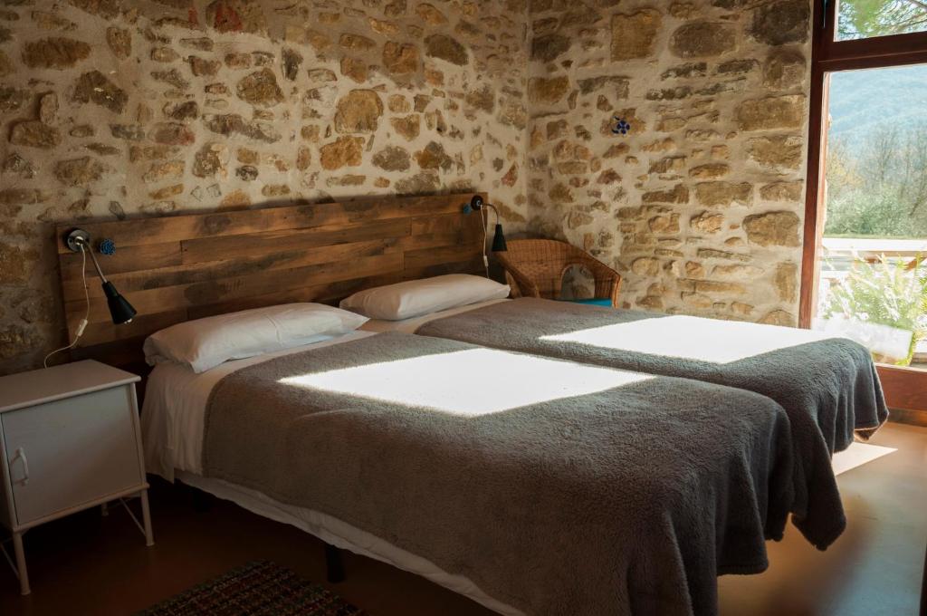Postel nebo postele na pokoji v ubytování Mas Ombravella