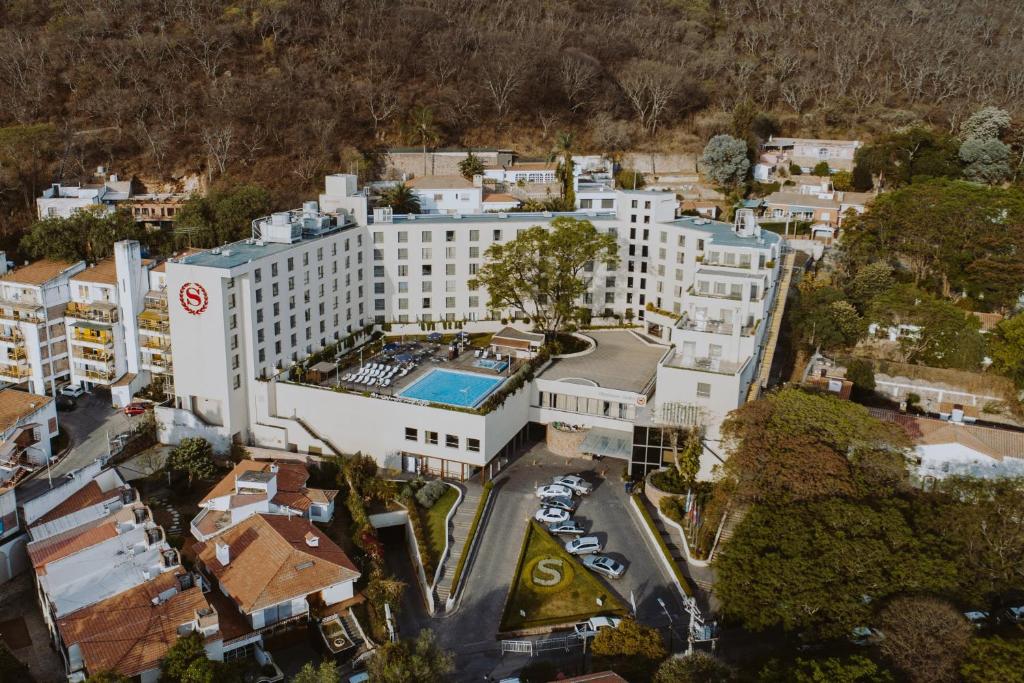 an overhead view of a large white building with a pool at Sheraton Salta Hotel in Salta