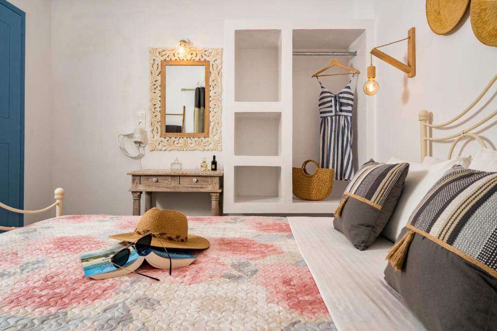 Ένα ή περισσότερα κρεβάτια σε δωμάτιο στο Cozy little house in Ios