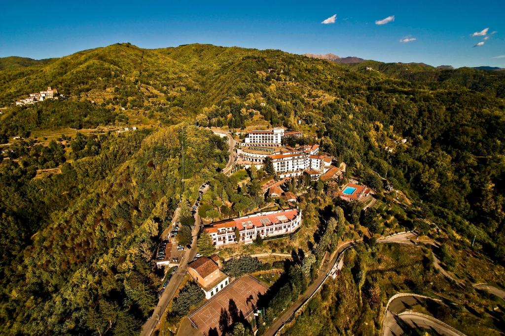 an aerial view of a building on a mountain at Renaissance Tuscany Il Ciocco Resort & Spa in Barga