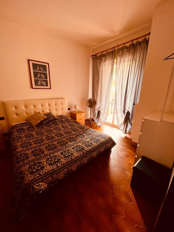 Postel nebo postele na pokoji v ubytování Condominio Ulivi