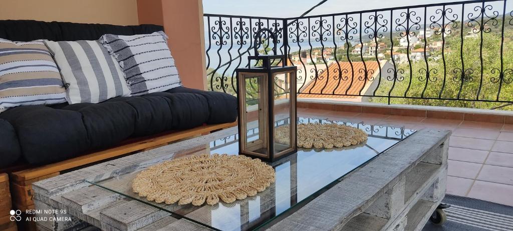 a living room with a couch and a table at Sofia's pottery house in Volos