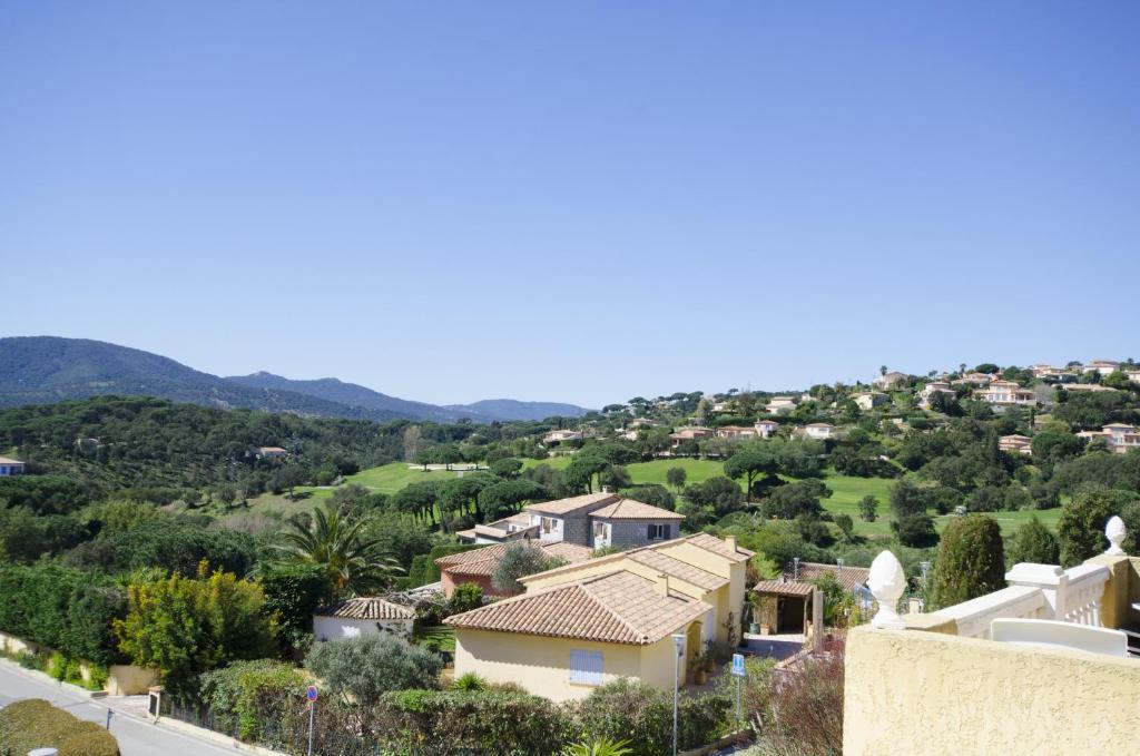 a view of a village from the roof of a house at Grande Villa à Sainte Maxime - Golfe de Saint Tropez in Sainte-Maxime
