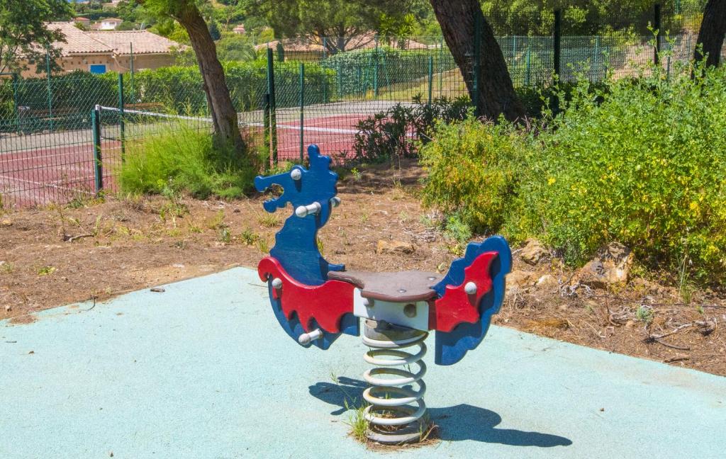 a playground with a slide in a park at Grande Villa à Sainte Maxime - Golfe de Saint Tropez in Sainte-Maxime
