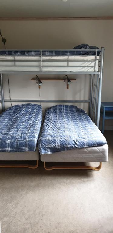 Postel nebo postele na pokoji v ubytování Lönneberga Vandrarhem & Hostel