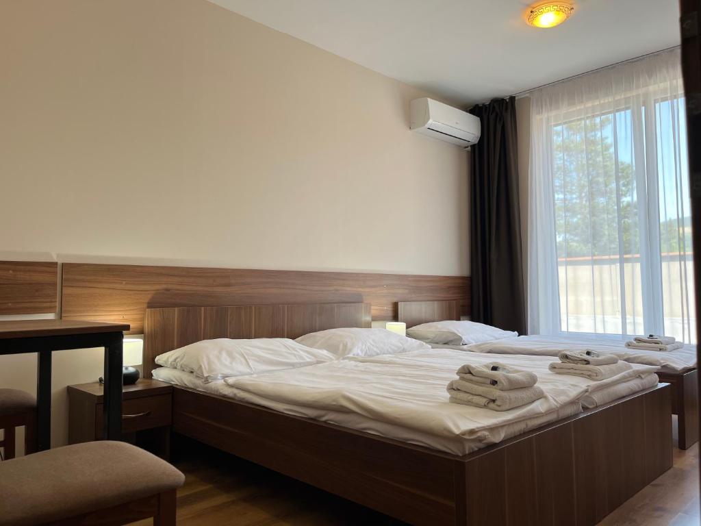 Postel nebo postele na pokoji v ubytování Hotel Aréna