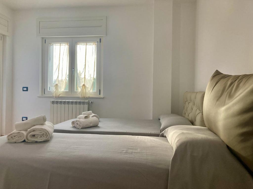 Postel nebo postele na pokoji v ubytování B&B Sabbia e Sassi