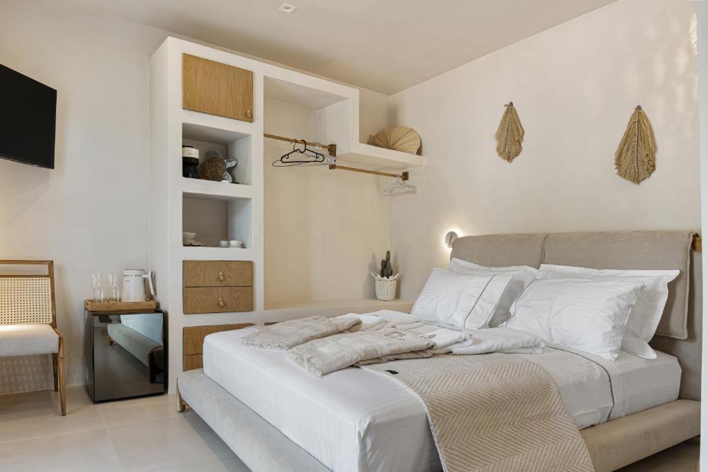 Postel nebo postele na pokoji v ubytování Tellion Suites