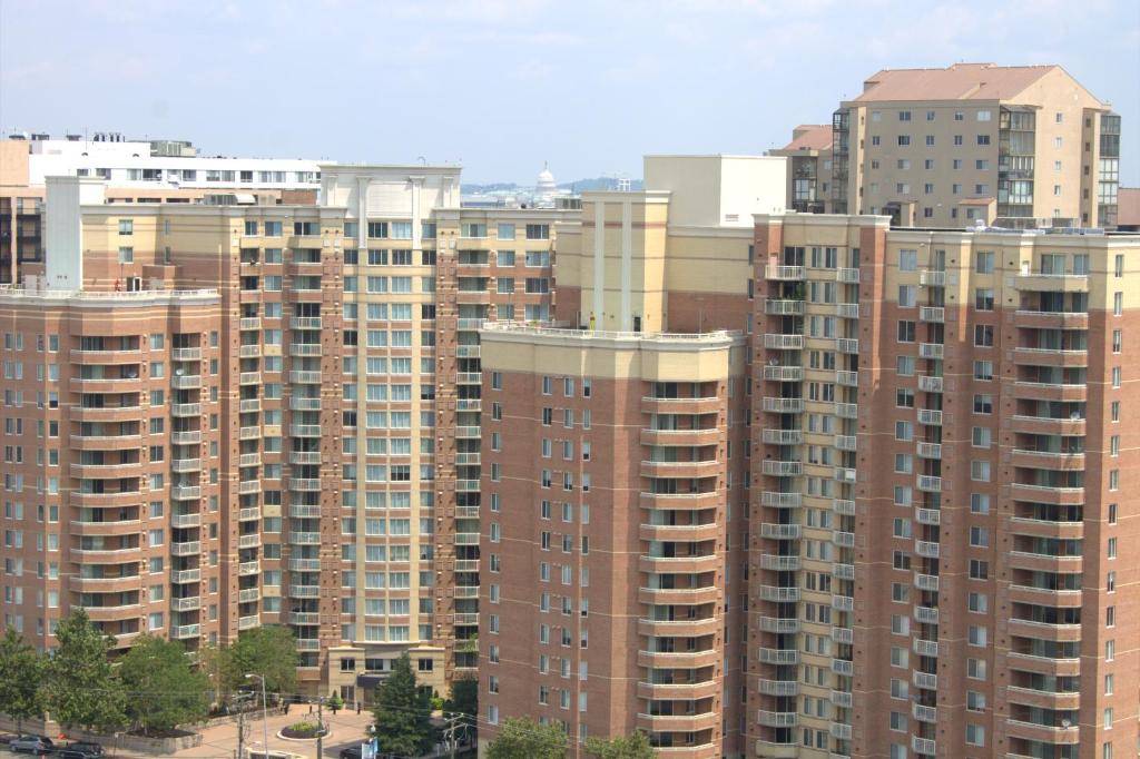 a group of tall buildings in a city at Crystal Quarters Corporate Housing at The Gramercy in Arlington