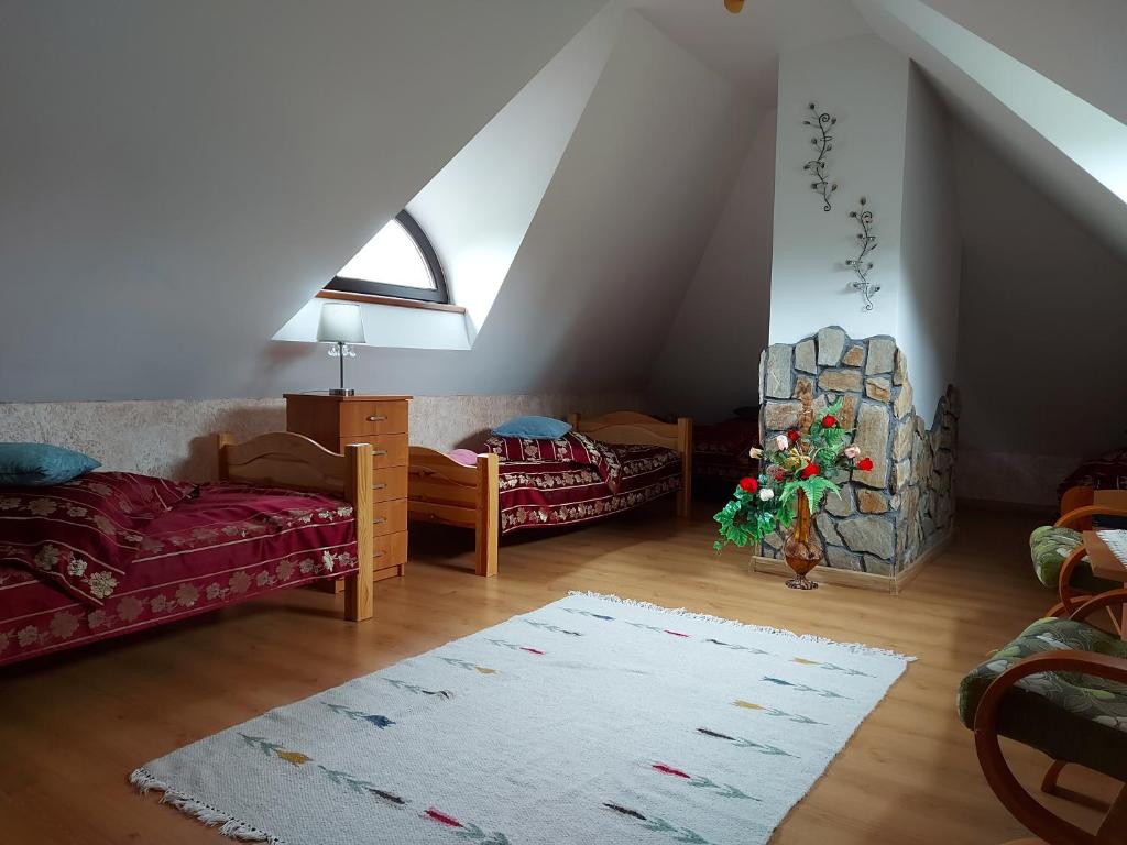 Posteľ alebo postele v izbe v ubytovaní Bieszczadzki Dworek