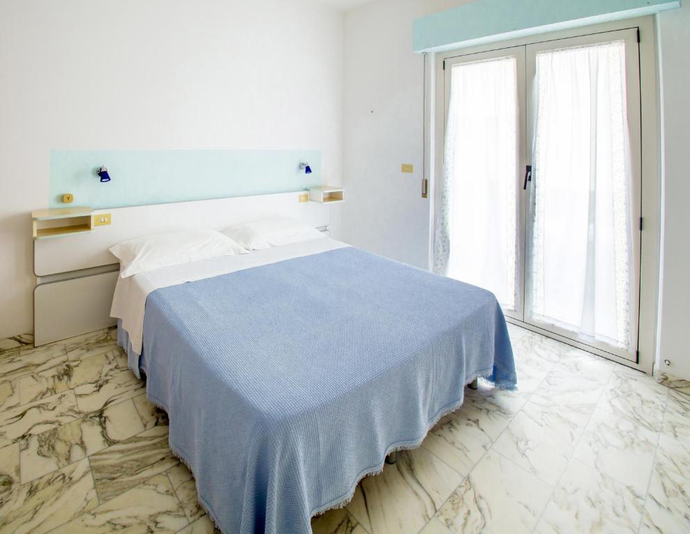 Postel nebo postele na pokoji v ubytování Albergo Il Veliero